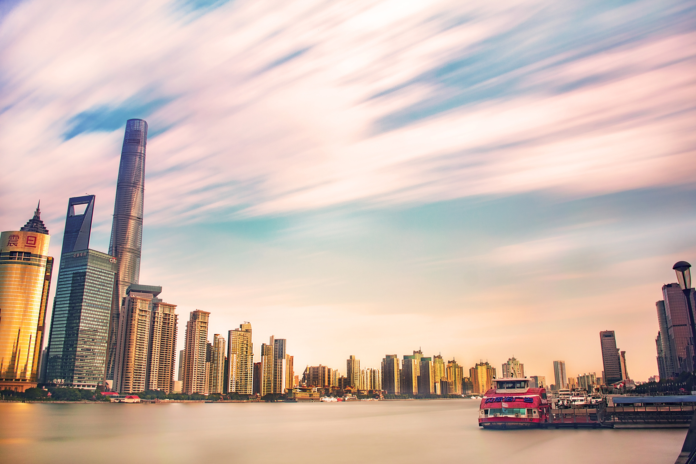 High-rise Buildings Near Body Of Water During Golden Hour